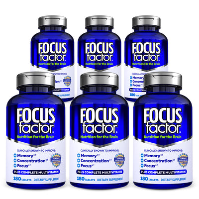 A row of blue bottles labeled "Focus Factor® Original†" showcases green and white text promoting it as a brain nutrition supplement. Each bottle emphasizes benefits such as enhanced memory and concentration, combining focus-enhancing properties with a multivitamin formula.