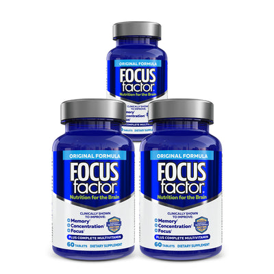 Three blue bottles of "Focus Factor® Original†" are elegantly displayed, promising enhanced concentration and memory support. The label highlights benefits for focus and includes a complete multivitamin. Each bottle contains 60 tablets, designed to effectively bolster brain health.