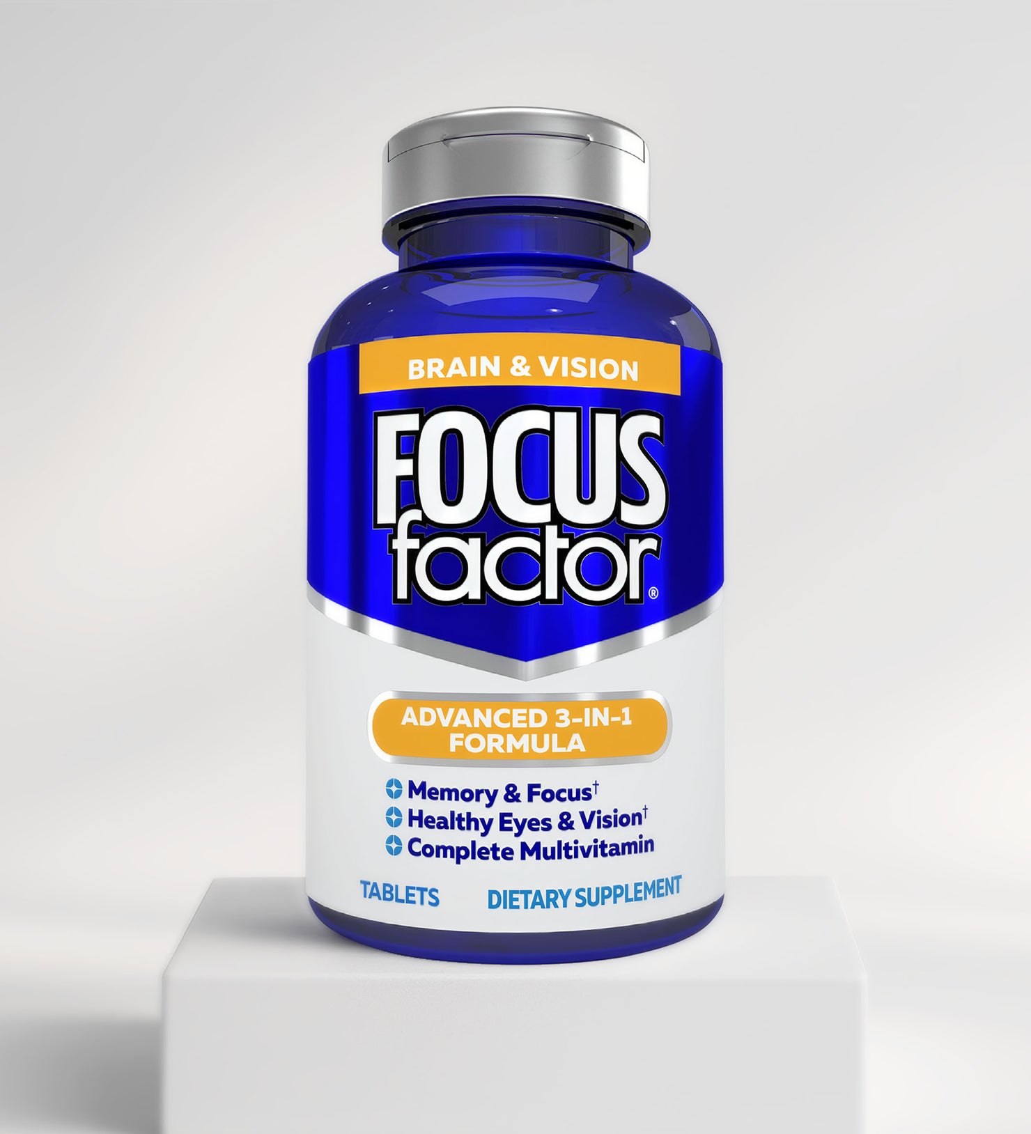 A blue bottle of Focus Factor® Brain & Vision Formula sits on a white pedestal, featuring a 3-in-1 blend for memory, focus, healthy eyes, cognitive support, and multivitamin benefits.