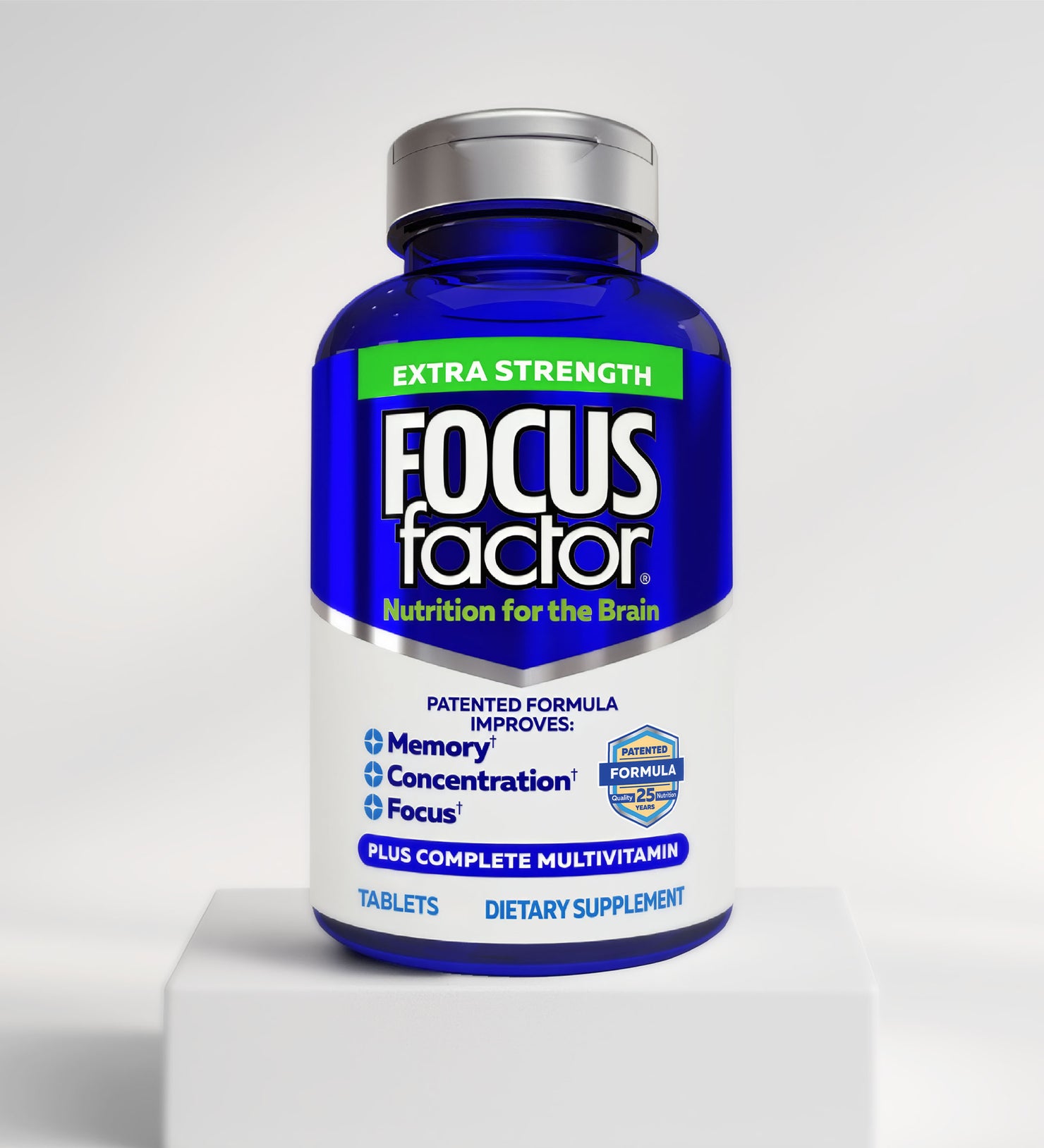 A blue bottle of Focus Factor® Extra Strength Formula - Memory, Concentration & Focus* sits on a white platform, with the label highlighting brain health benefits and its complete multivitamin inclusion.