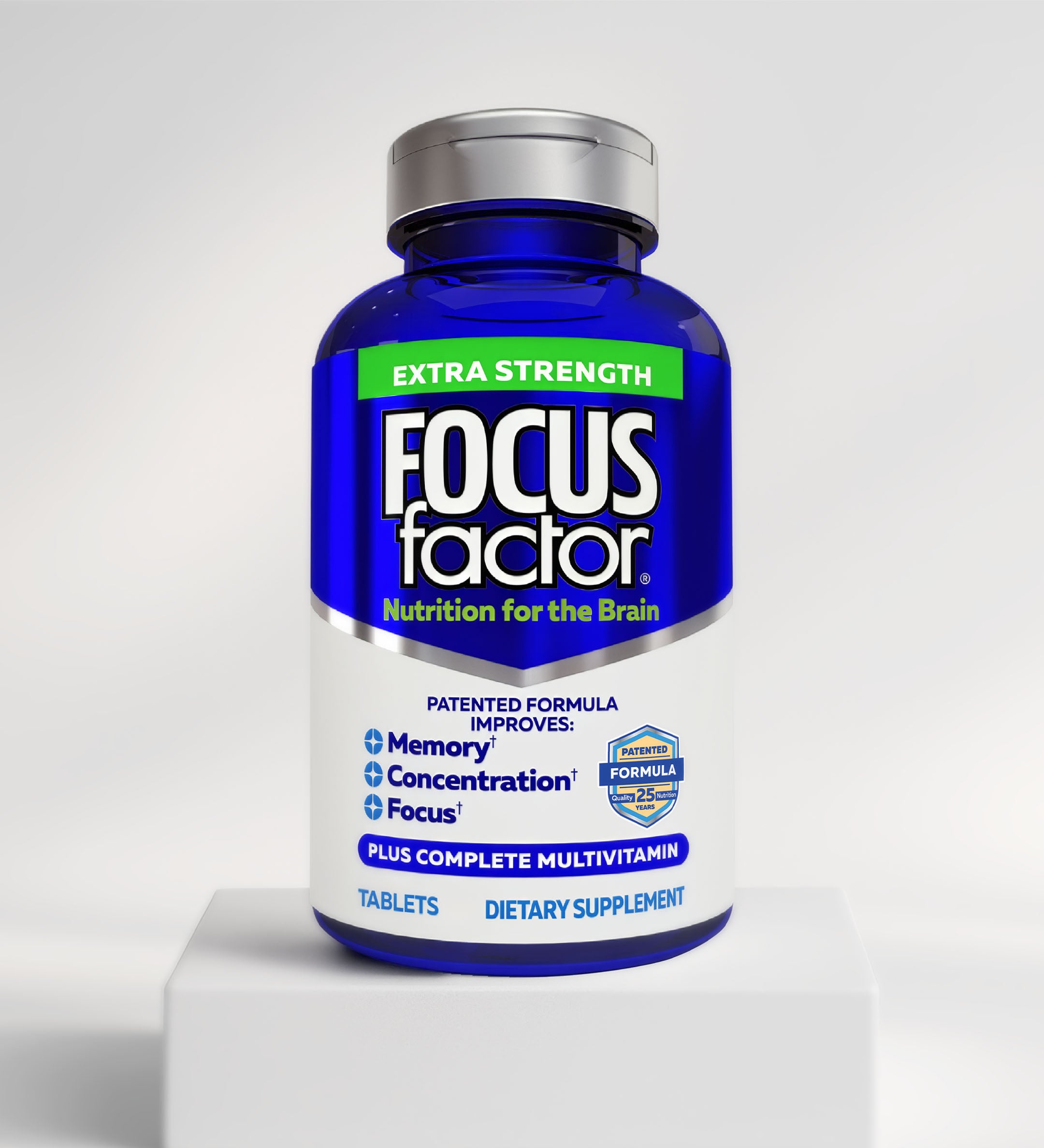 A blue bottle of Focus Factor® Extra Strength Formula - Memory, Concentration & Focus* sits on a white platform, with the label highlighting brain health benefits and its complete multivitamin inclusion.