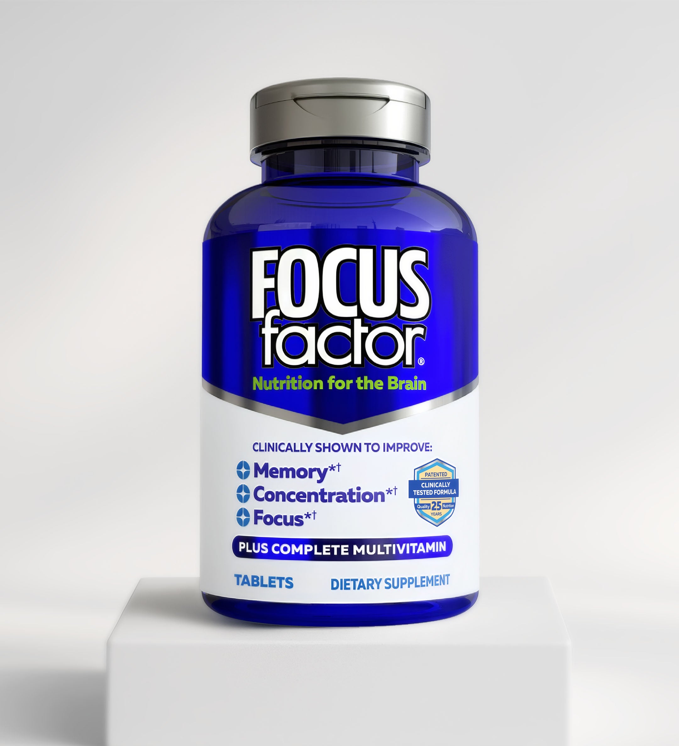 A blue and white bottle of Focus Factor® Clinically Tested Original Formula is shown on a white platform, labeled "Nutrition for the Brain," supporting memory, concentration, and focus.*.